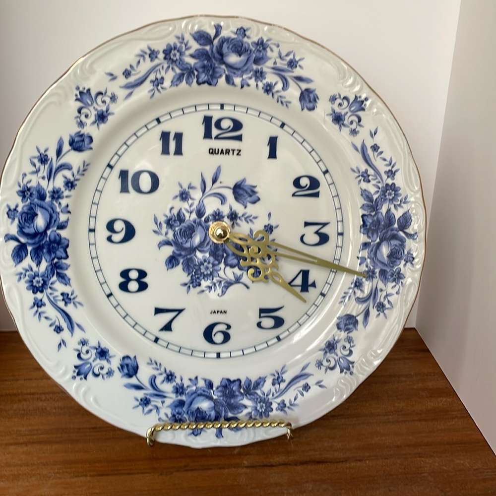 Blue Floral porcelain plate clock with brass hands.
